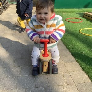 Prep school nursery - pupil playing on tricycle