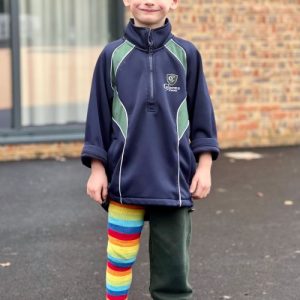 student wearing one full leg length stripy sock