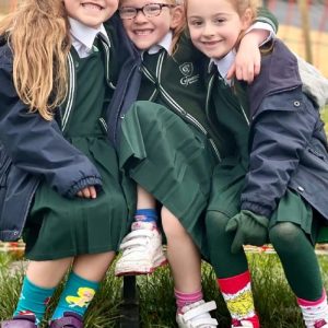 young students showing off their odd socks