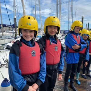 students in water safety gear
